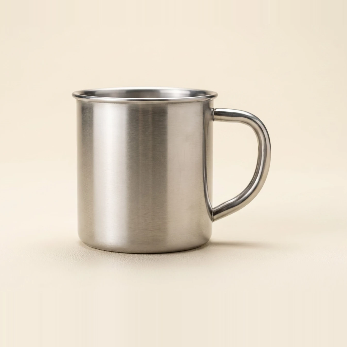 Brushed stainless steel mug with a rolled rim and a welded loop handle